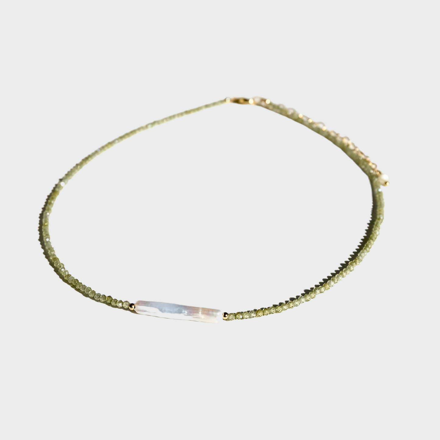 Green zircon necklace with baroque pearl